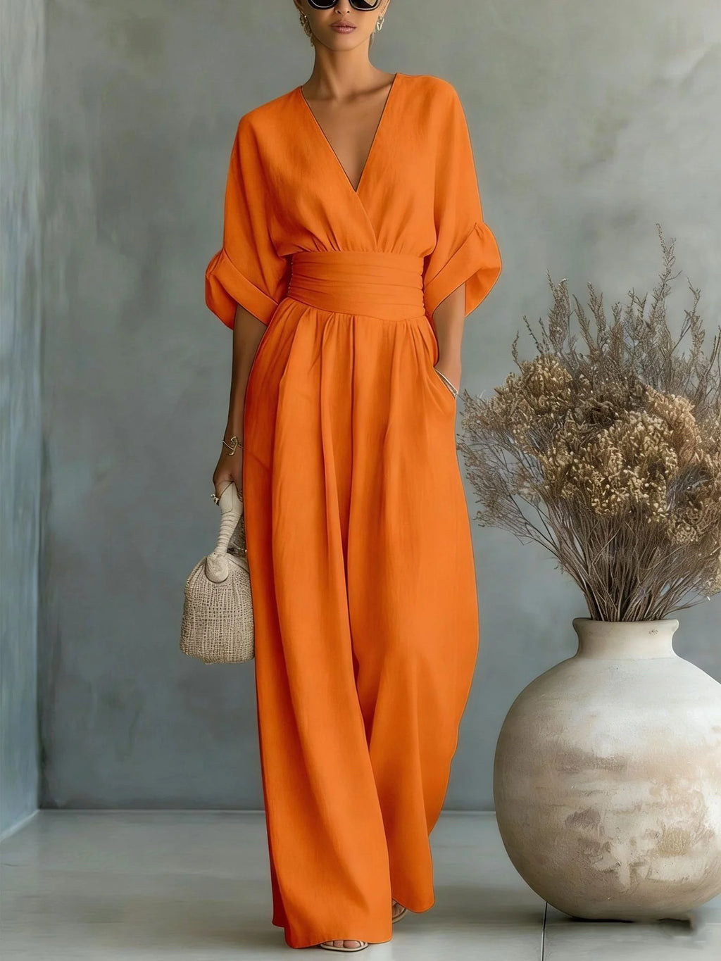 Eleganter Ärmelloser Jumpsuit mit Tiefem V-Ausschnitt, Taillenbund und Weitem Bein