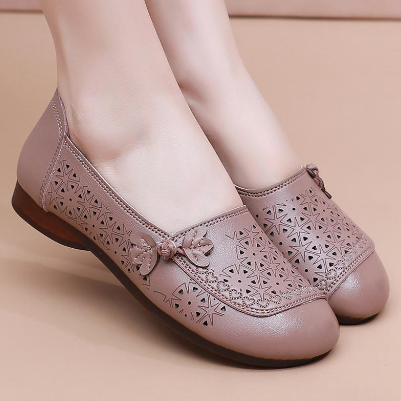 Zapatos de suela suave de goma flexible con perforaciones