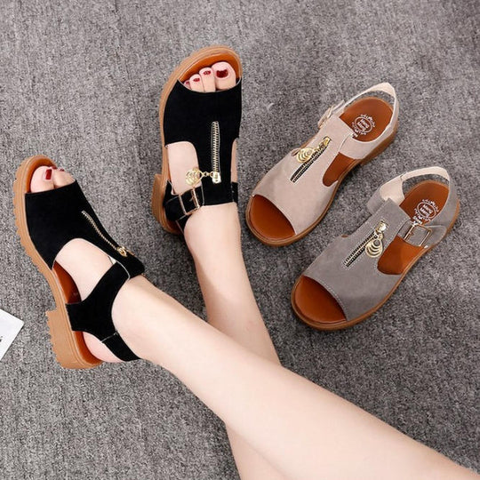 Sandalias planas de piel de res con tacón bajo